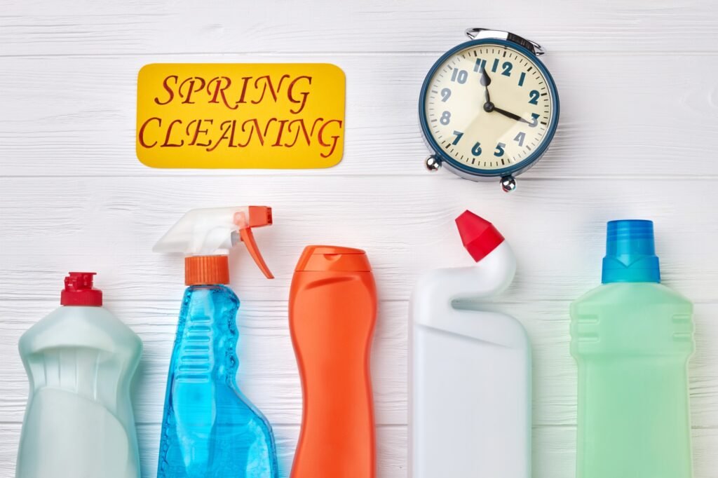 Detergent bottles on wooden background.